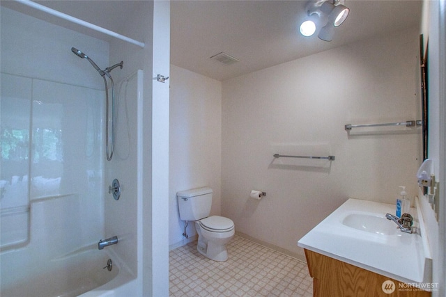 121 Switchback Rd, Orcas Island, WA 98245 - bathroom featuring vanity, toilet, washtub / shower combination, tile patterned floors, and baseboards