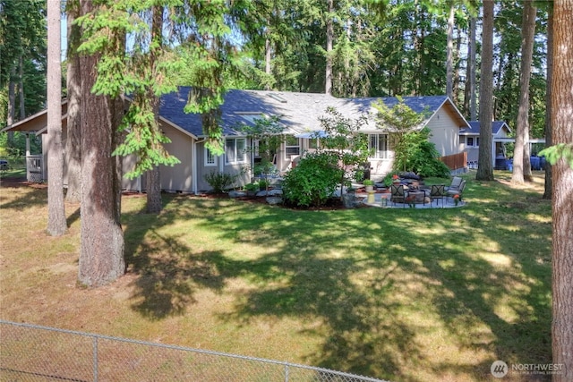 6610 6th Ave SE, Lacey, WA 98503 - view of front of house featuring a shingled roof, a patio, and an outdoor fire pit