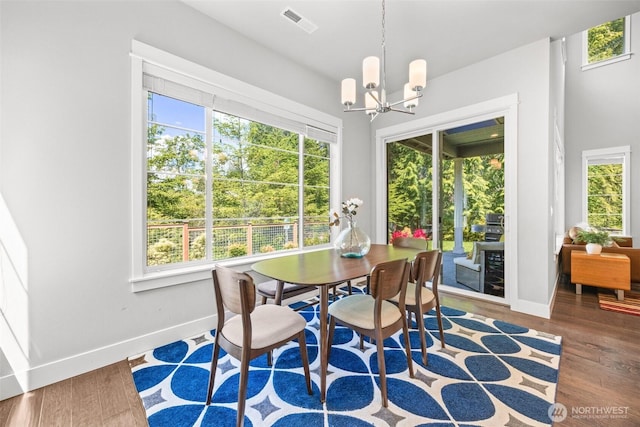 21888 SE 5th Pl, Sammamish, WA 98074 - dining area with baseboards, a chandelier, and wood finished floors