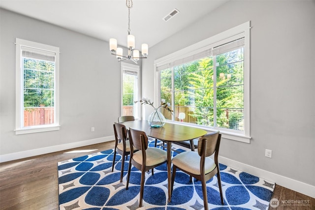 21888 SE 5th Pl, Sammamish, WA 98074 - dining space featuring healthy amount of natural light, a chandelier, baseboards, and wood finished floors