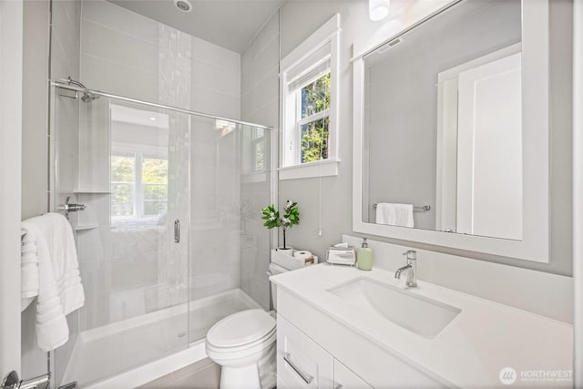21888 SE 5th Pl, Sammamish, WA 98074 - bathroom featuring a shower stall, vanity, and toilet