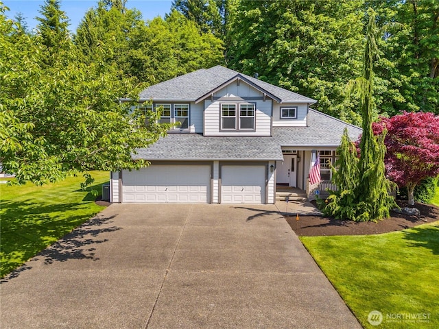 3410 33rd Way NW, Olympia, WA 98502 - tri-level home featuring roof with shingles, asphalt driveway, an attached garage, covered porch, and a front yard