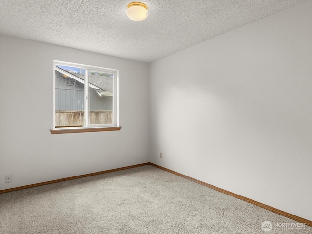 17509 16th Ave E, Spanaway, WA 98387 - unfurnished room with carpet floors, baseboards, and a textured ceiling