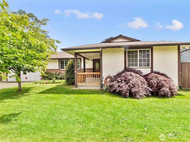 17509 16th Ave E, Spanaway, WA 98387 - view of front facade with a front yard, an attached garage, and brick siding