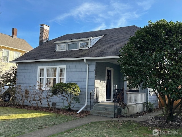1228 22nd Ave, Longview, WA 98632 - bungalow featuring a shingled roof, a porch, a chimney, and a front yard