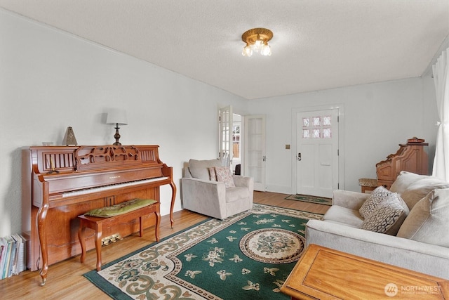 1228 22nd Ave, Longview, WA 98632 - living room featuring wood finished floors and a textured ceiling