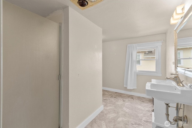 1228 22nd Ave, Longview, WA 98632 - full bathroom with a shower stall and baseboards