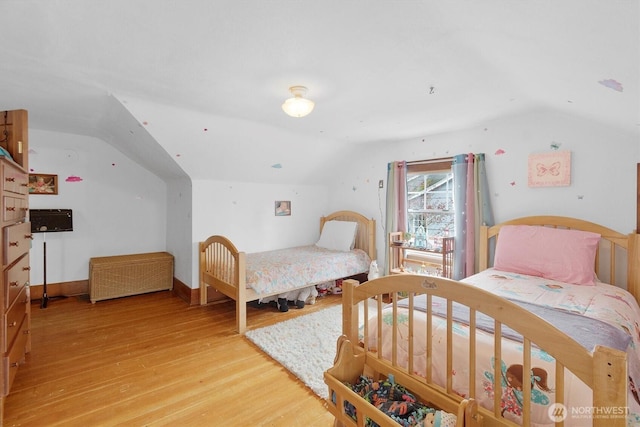 1228 22nd Ave, Longview, WA 98632 - bedroom with lofted ceiling and light wood finished floors