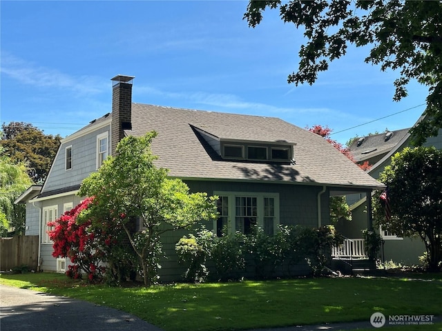 1228 22nd Ave, Longview, WA 98632 - view of front facade with a chimney and a shingled roof