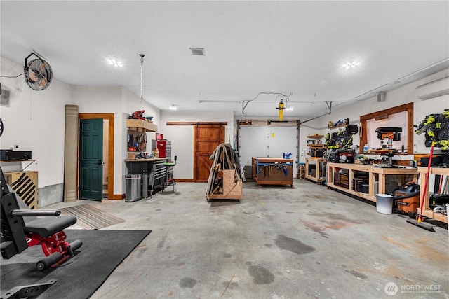 18880 Pine Loop, Leavenworth, WA 98826 - garage with a workshop area and a wall mounted AC