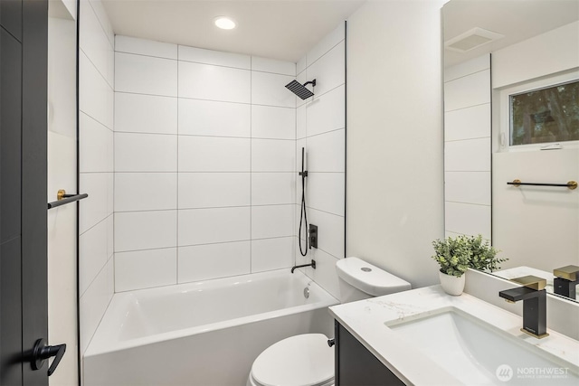 8513 19th Ave NW Unit A, Seattle, WA 98117 - bathroom featuring toilet, vanity, bathing tub / shower combination, and recessed lighting