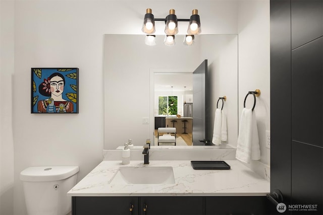 8513 19th Ave NW Unit A, Seattle, WA 98117 - bathroom with vanity, toilet, and a chandelier