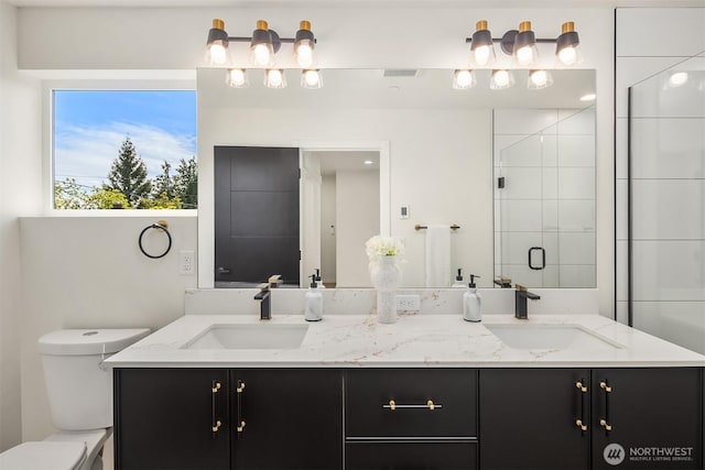 8513 19th Ave NW Unit A, Seattle, WA 98117 - bathroom with toilet, double vanity, and a shower stall