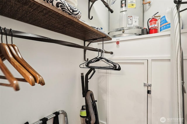 2415 2nd Ave Unit 543, Seattle, WA 98121 - detailed view of electric water heater and a fire extinguisher
