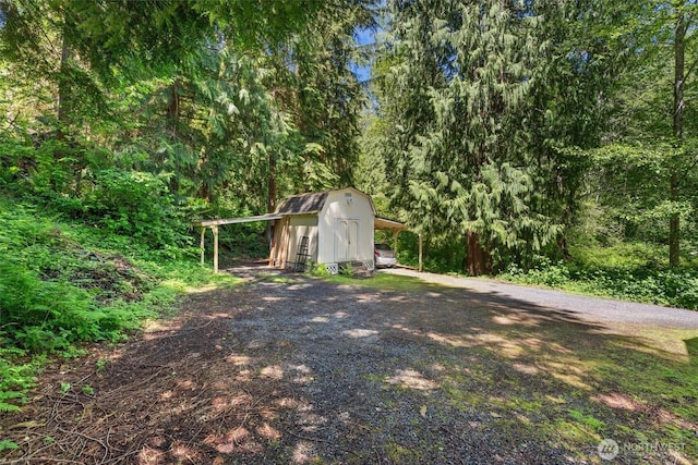 4628 109th Ave SE, Snohomish, WA 98290 - view of yard featuring gravel driveway and a view of trees