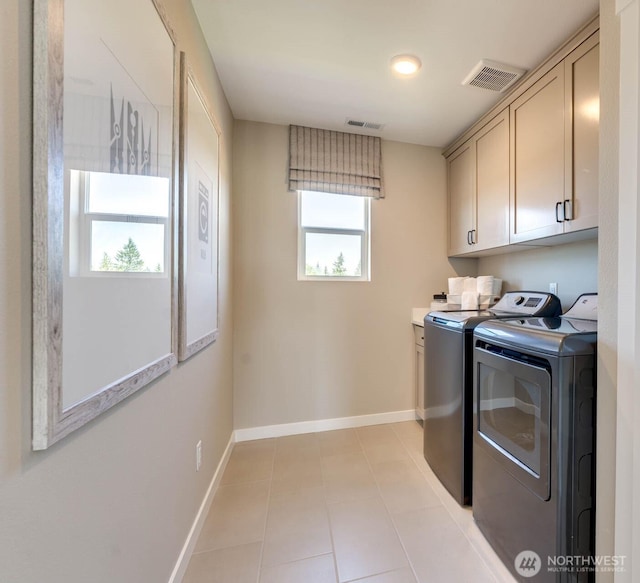 20332 150th St E Unit 589, Bonney Lake, WA 98391 - laundry area with cabinet space, independent washer and dryer, baseboards, and light tile patterned flooring