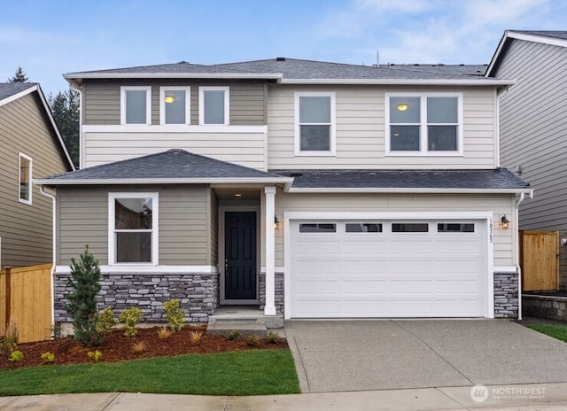 20332 150th St E Unit 589, Bonney Lake, WA 98391 - view of front of property with concrete driveway, stone siding, and an attached garage