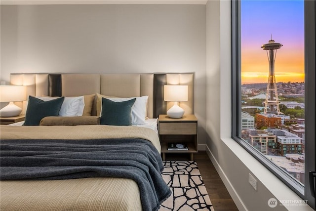 2510 6th Ave Unit 2802, Seattle, WA 98121 - bedroom featuring wood finished floors and baseboards