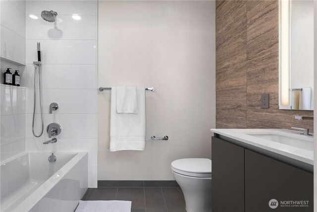 2510 6th Ave Unit 2802, Seattle, WA 98121 - full bath featuring vanity, tile patterned floors, toilet, and tub / shower combination