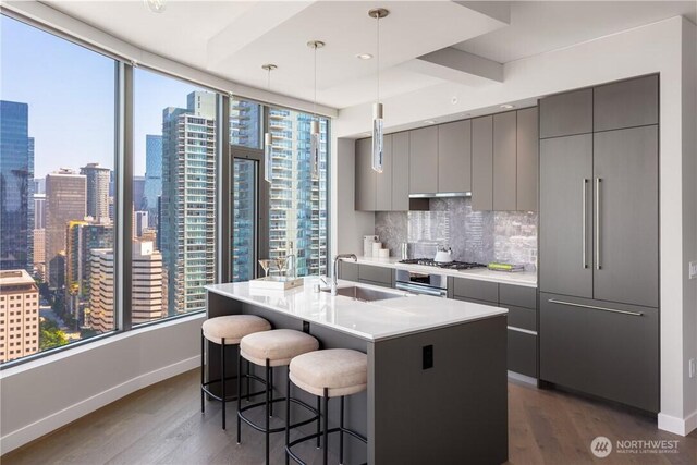 2510 6th Ave Unit 2802, Seattle, WA 98121 - kitchen with a sink, stainless steel appliances, modern cabinets, and baseboards