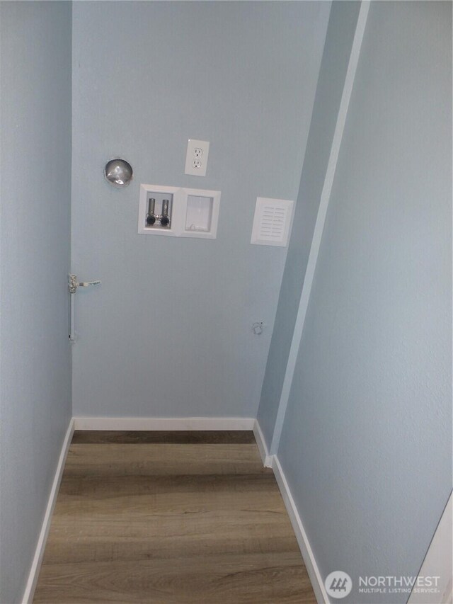 1707 258th Pl, Ocean Park, WA 98640 - laundry room with hookup for a washing machine, wood finished floors, baseboards, and gas dryer hookup