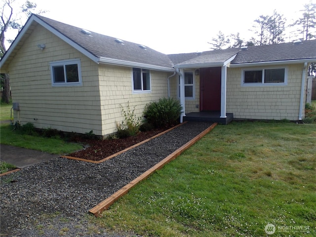 1707 258th Pl, Ocean Park, WA 98640 - single story home with a front yard and roof with shingles