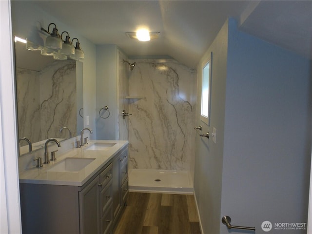 1707 258th Pl, Ocean Park, WA 98640 - bathroom with wood finished floors, double vanity, and a marble finish shower