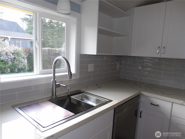 1707 258th Pl, Ocean Park, WA 98640 - kitchen featuring a sink, open shelves, white cabinetry, and decorative backsplash