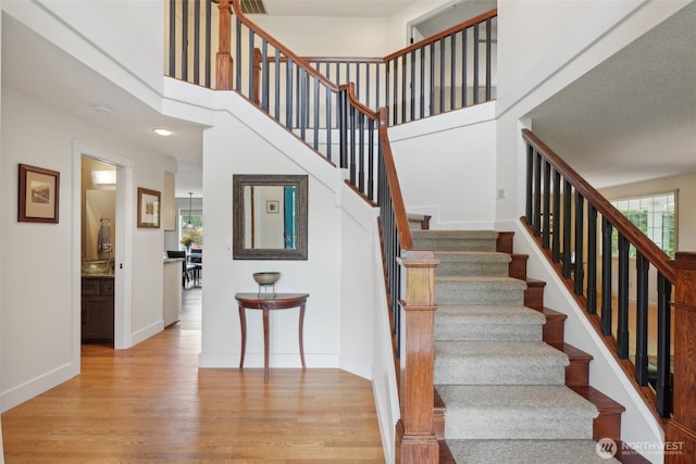 8906 NE 275th St, Battle Ground, WA 98604 - stairway featuring wood finished floors and baseboards