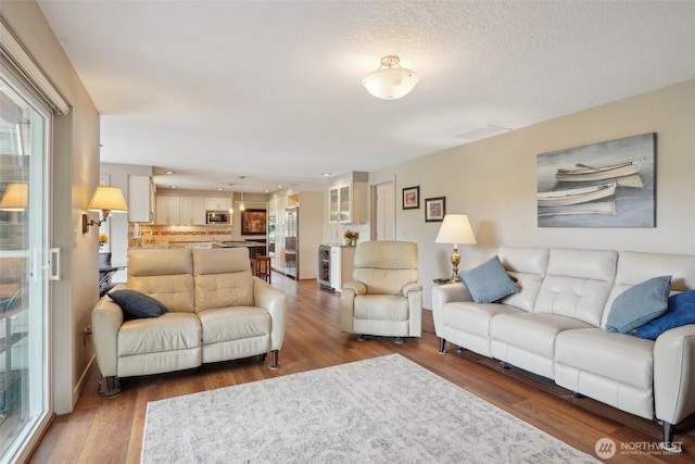 8906 NE 275th St, Battle Ground, WA 98604 - living area with wood finished floors and wine cooler
