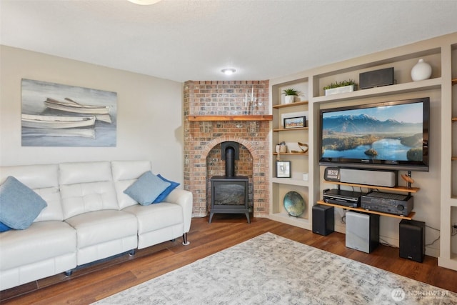 8906 NE 275th St, Battle Ground, WA 98604 - living room with a wood stove and wood finished floors