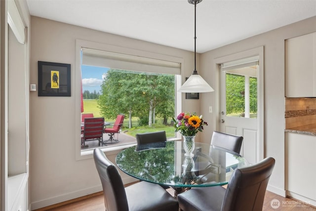 8906 NE 275th St, Battle Ground, WA 98604 - dining space featuring baseboards and light wood-style flooring