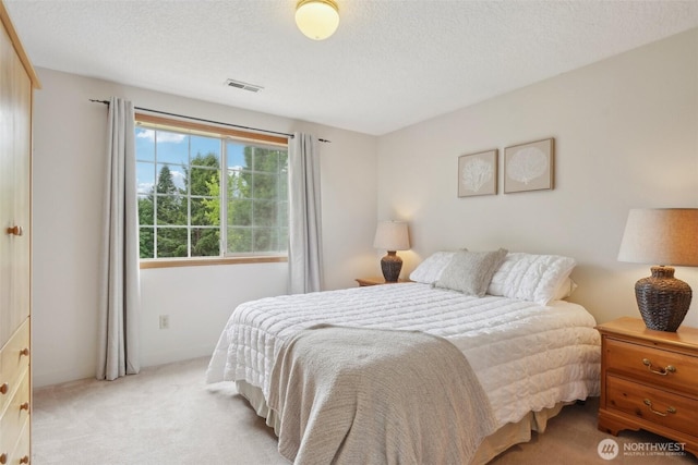 8906 NE 275th St, Battle Ground, WA 98604 - bedroom with light carpet and a textured ceiling