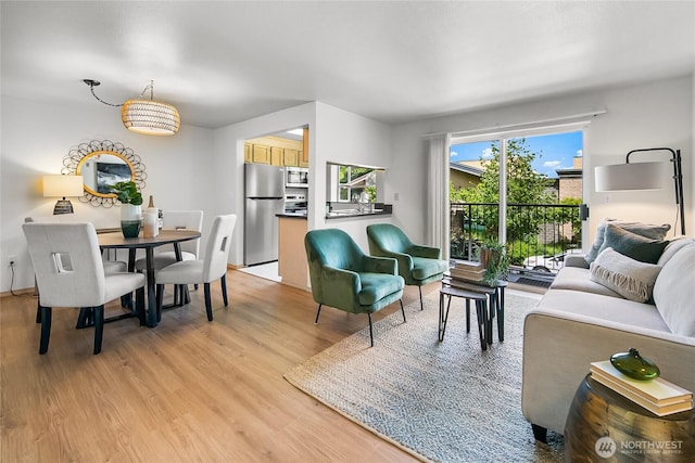 12056 15th Ave NE Unit 204, Seattle, WA 98125 - living area featuring light wood-style floors