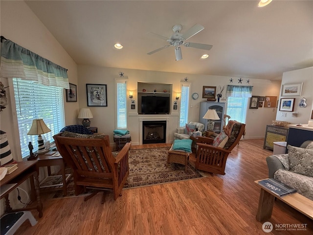 30511 M Pl, Ocean Park, WA 98640 - living area featuring light wood-type flooring, ceiling fan, a fireplace, vaulted ceiling, and recessed lighting