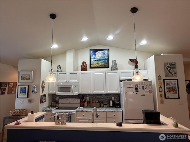 30511 M Pl, Ocean Park, WA 98640 - kitchen with white appliances, lofted ceiling, white cabinetry, tasteful backsplash, and decorative light fixtures