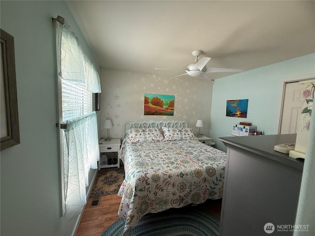 30511 M Pl, Ocean Park, WA 98640 - bedroom featuring wood finished floors, a ceiling fan, and wallpapered walls