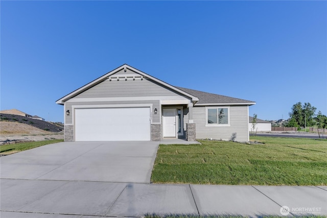 311 W Sandy Loop, Moses Lake, WA 98837 - ranch-style home featuring a garage, driveway, a front lawn, and stone siding