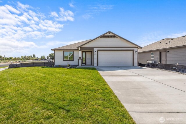 311 W Sandy Loop, Moses Lake, WA 98837 - ranch-style house featuring an attached garage and driveway