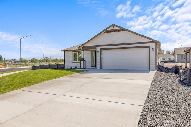 311 W Sandy Loop, Moses Lake, WA 98837 - ranch-style home featuring driveway and an attached garage