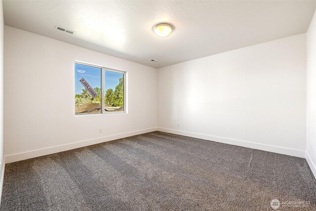 311 W Sandy Loop, Moses Lake, WA 98837 - empty room featuring dark carpet
