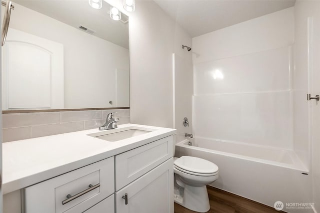311 W Sandy Loop, Moses Lake, WA 98837 - full bathroom featuring vanity, wood finished floors, and shower / tub combination