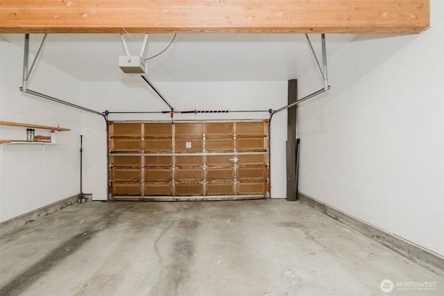 1819 Kuhn St, Port Townsend, WA 98368 - garage featuring a garage door opener and baseboards