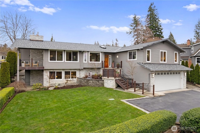 9317 192nd Pl SW, Edmonds, WA 98020 - view of front facade featuring a chimney, an attached garage, a front yard, asphalt driveway, and stone siding