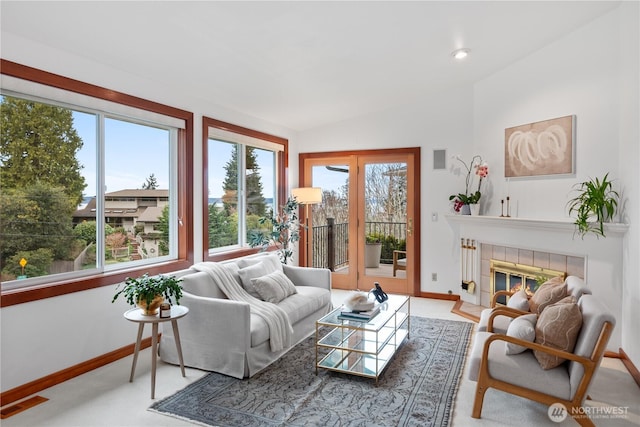 9317 192nd Pl SW, Edmonds, WA 98020 - living area with lofted ceiling, a tile fireplace, and carpet flooring