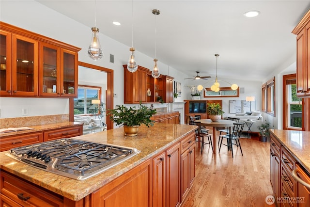 9317 192nd Pl SW, Edmonds, WA 98020 - kitchen featuring stainless steel appliances, ceiling fan, open floor plan, light wood finished floors, and vaulted ceiling