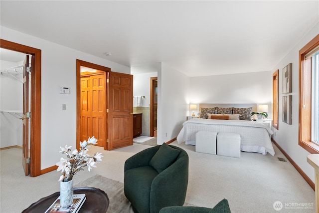 9317 192nd Pl SW, Edmonds, WA 98020 - bedroom with a spacious closet, light colored carpet, a closet, and ensuite bath