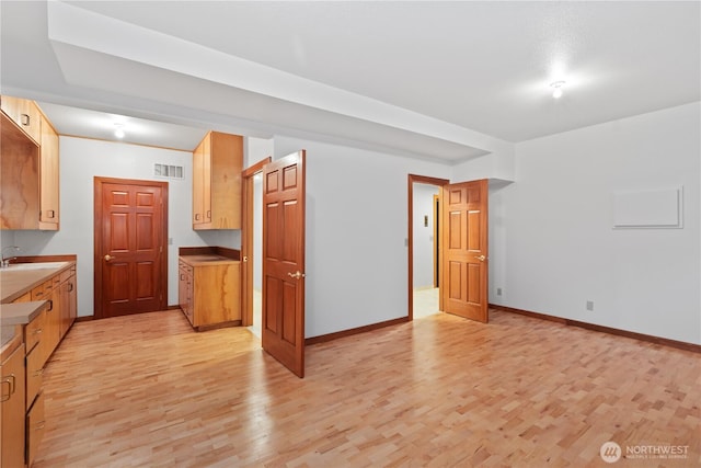 9317 192nd Pl SW, Edmonds, WA 98020 - kitchen with light wood-style floors and a sink