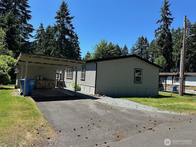 8906 225th Street Ct E, Graham, WA 98338 - view of front of property featuring driveway, a front yard, and an attached carport