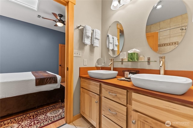 140 Twisp Ave W Unit 204, Twisp, WA 98856 - full bathroom featuring double vanity, connected bathroom, a ceiling fan, and tile patterned floors